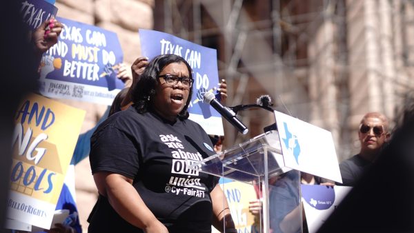 Charlie Bates, a sixth-grade reading and language arts teacher at Cypress-Fairbanks ISD, speaks in front of the crowd at today's rally at the Texas Capitol. “Without our public schools, our communities will not survive,” she said.