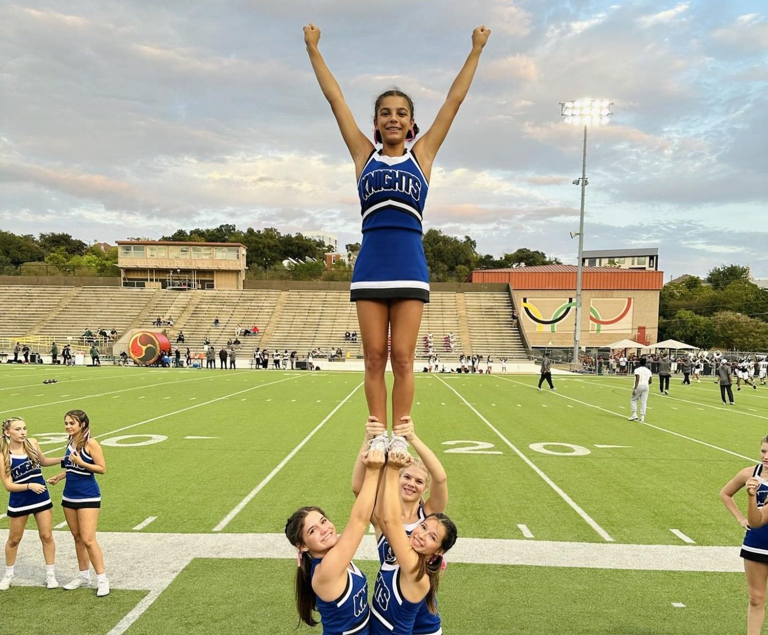 When the school schedule made it impossible for to Morton to make gymnastic practice, she shifted her focus to being a high-flying cheerleader. Photo courtesy of Bell Morton.