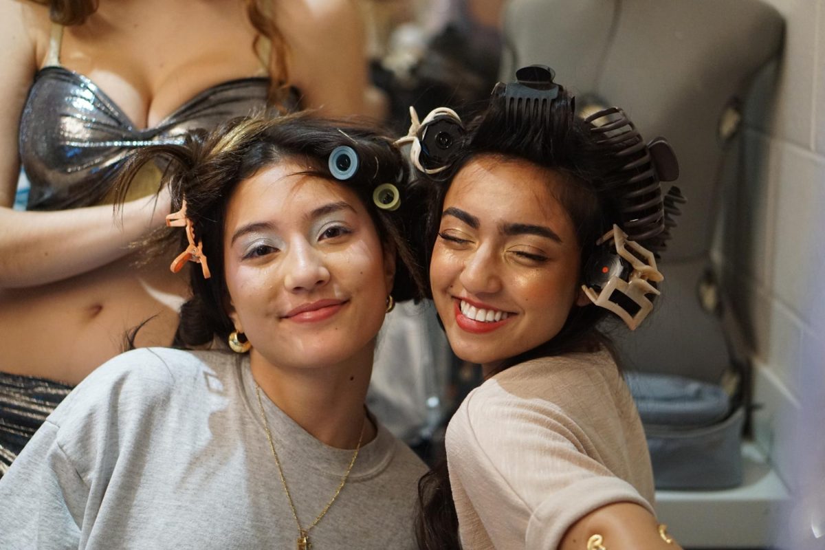 Sophomore model Maggie Peterson and Junior model/designer Mira Patel getting ready before the show