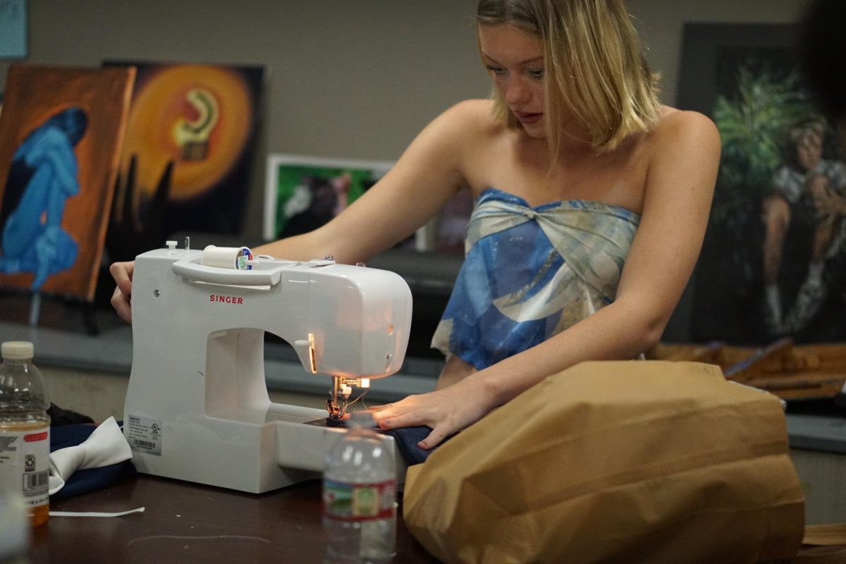 Senior designer London Holtz making last minute adjustments to her pieces. 