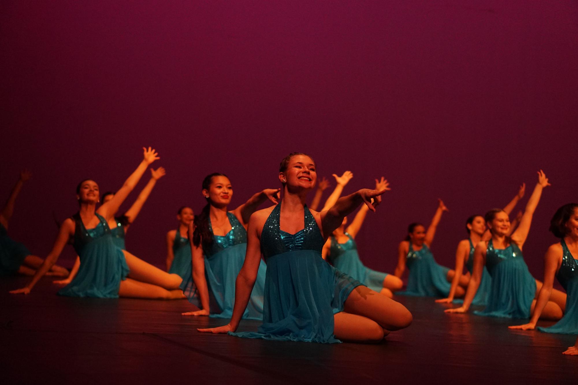 SOMEONE IN THE CROWD: The McCallum Blue Brigade performs their opening dance to the song ‘Someone in the Crowd’ choreographed by Junior Lieutenant Paige Mitchell and First Lieutenant Gaby Alvarado. Senior Greta Waymay hits her final end pose completing her last opening dance as a member of the Blue Brigade. 

Wayman has been watching the Blue Brigade perform their opening dance since her sister performed as a member. Wayman was a 4 year member on the team and said this opening dance was her favorite. 

“I loved this year's opener because I loved the song,” Wayman said. “I also loved how energetic the dance was.” 

For Wayman, however, performing this opener was a bittersweet moment as her last performance on Blue Brigade. 

“It didn’t really hit me during the opener that it was my last spring show,” Wayman said. “Although it did hit later in the show.” 

Wayman said her favorite part about performing with Blue Brigade over the years has always been being able to do it with some of her best friends.

“I love being able to perform with all my friends,” Wayman said. “Growing with a tight knit community that Blue Brigade creates is my favorite part.” 

Aside from performing the dances, Wayman said the show was an important moment to watch her fellow seniors say their goodbyes. 

“I loved getting to see all of the senior solos and cheer on my friends from backstage,” Wayman said. 

Caption by Chloe Seckar-Martinez. Photo by Daniela Di-Capua. 
