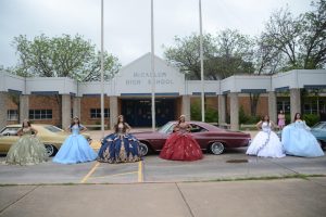Quinceañeras Alexis Jimenez, Yami Salas, Sofia Arredondo, Valeria Barrientos, Sadie Mason and Evelyn Martinez Mercado pose for a photo outside the school. The image captures their grand entrance to their collective quinceañera. This Saturday, McCallum held the quinceañera in the cafeteria allowing students to partake in the traditional Hispanic coming of age celebration without the expenses associated. Señora Altamirano-Cancino and the Ballet Folklorico Club came together to organize the event and with help from the local community were able to cover all aspects of the celebration from the lowrider cars for the students to arrive in to the DJ and dresses and suits that students were able to rent out or have donated. 
Caption by Josie Mullan.