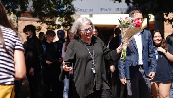 The iconic band director is all smiles after Austin City Councilman Mike Siegel proclaimed it to be Carol Nelson Day in Austin.