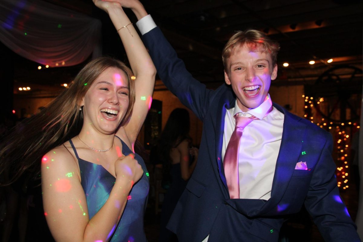 ONE LAST TIME: Senior Zalie Mann and junior Ronan Henson dance at prom, the last McCallum dance both of them will ever attend. Despite not being a senior, Henson was able to attend with the invitation from his senior friend Gabrielle Rodriquez. Attending Zach Academy for theater next year, this is Henson’s last year at McCallum, and so in that sense, attending prom for him felt like a senior experience.

Henson enjoyed how the night went, and felt that it was a big improvement from the prom he had attended at the same venue a week before.

“I went to Bowie prom, and it was really boring,” he said. “This one was much more fun, everyone was dancing, and it had a much better vibe. I think the environment was super nice, like how it was set up with the lights and music, but everyone dancing and having a good time together made it really fun. We definitely utilized the space much better.”

One thing Henson won’t forget about prom was getting to enjoy being around his senior friends for one of the last times and making memories with them.

“Dancing and getting to reconnect with friends I've been making throughout the past three years in one spot was just amazing,” he said. “It felt like a super good ending to the year, and a nice sign off for sure.”

Caption by Priya Thoppil.
