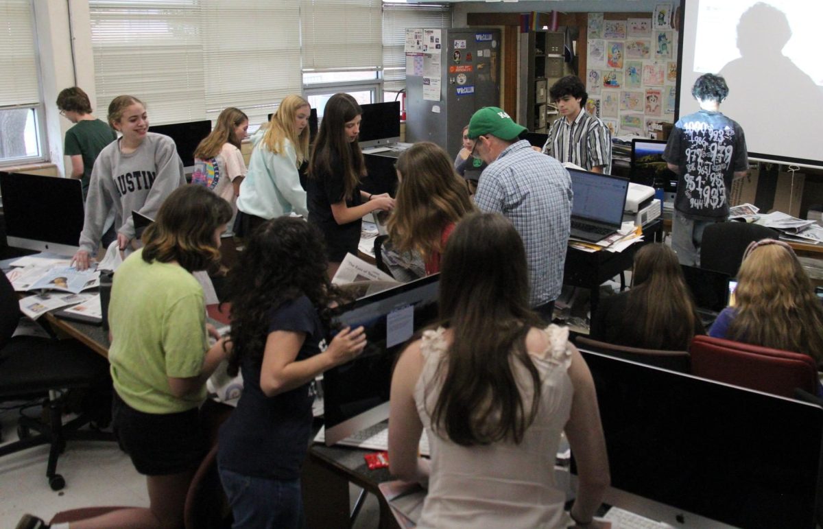 During a class game, photojournalism teacher David Winter’s students frantically search issues of The Shield to find the layout that Winter asked for. Before the game, he had gone over different types of newspaper layouts, and now the students’ knowledge was being put to the test. For freshman Anais Long, the game was a fun distraction from the stressful environment of the end of the year. 
“It was so fun running around chasing each other and I got to work with my best friends,” she said. “My team and I all just grabbed a newspaper and were kind of screaming at each other.”

