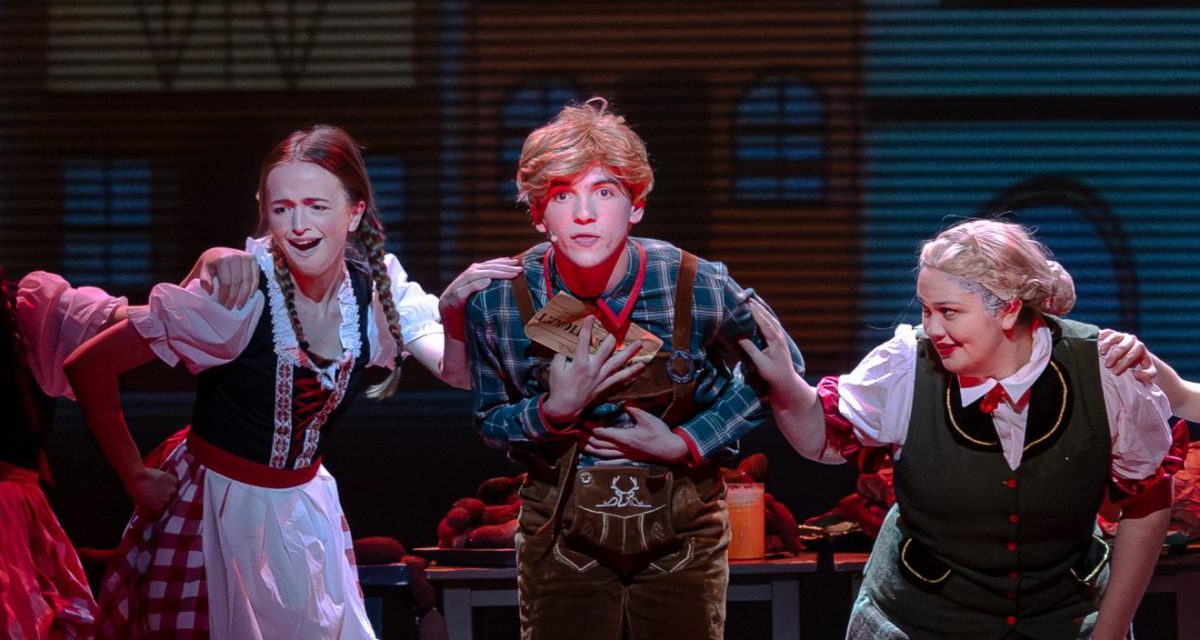 Sophomore Max Marcus (center) and junior Finley Mcbride (left) perform as Augustus Gloop in the 2025 STS production of "Charlie and the Chocolate Factory."