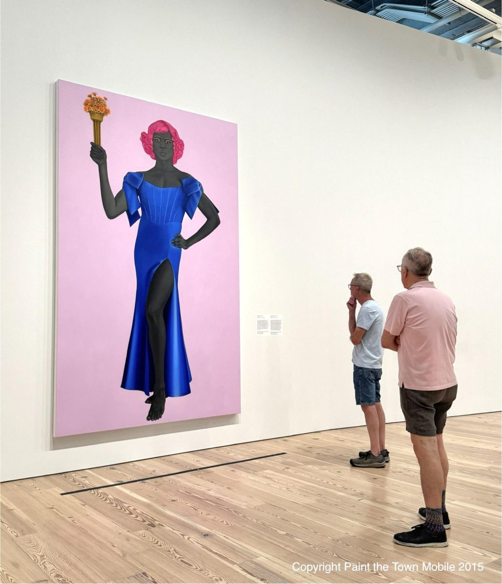 Museum goers viewing Trans Forming Liberty by Amy Sherald. Photo accessed under creative commons on Flickr.