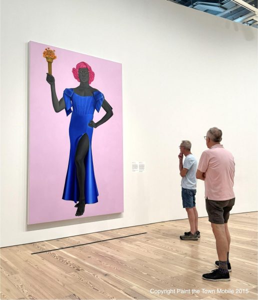 Museum goers viewing Trans Forming Liberty by Amy Sherald. Photo accessed under creative commons on Flickr.