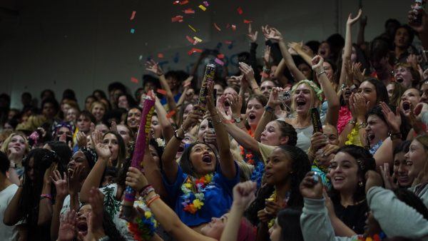 ONE LAST BATTLE CRY: Senior Valeria Villafuerte-Perez celebrates with her friends after the senior class won the spirit competition. At each pep rally, a different game is played with volunteers from the crowd. Villafuerte-Perez was nominated by her friends to play a game in which the goal was to snatch a pom-pom from an opponent.

“Before school started, my friends and I had talked about going all out for senior year, so I told them to nominate me for a game since it was our last [Shoal Creek Showdown] pep rally,” Villafuerte-Perez said. “I wasn’t really scared to go down to the floor in front of the whole school, all I was focused on was getting the crowd hyped for the game.”

Villafuerte-Perez entered the game determined to win. After several rounds, as there were just two people left, she managed to snatch the last pom just in time, in order to secure a victory for the senior class.

“I was really happy I won the game for the class of 2026,” Villafuerte-Perez said. “Honestly, I just wanted to win because seniors rule.”

As this was her first pep rally as a senior, the event carried extra meaning to Villafuerte-Perez.

“Being in the stands as a senior feels very surreal,” Villafuerte-Perez said. “I still remember my first  pep rally, and now I’m a senior having my last pep rally, I think in that moment it really set in that I’m a senior, and that I’m going to graduate soon.”

Caption by Sophia Manos. Photo by Julia Copas.