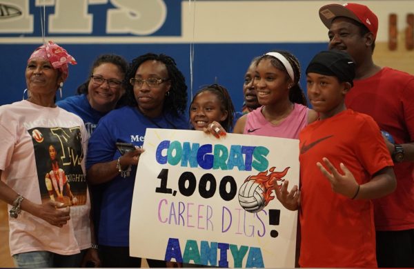 Senior Aaniya Thornton celebrates 1,000 digs with her family after the varsity volleyball game against the LASA Raptors on Friday, Sept. 12.