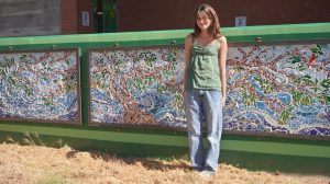 Jane McKenna with her finished Mosaic, outside the McCallum Arts Center. 