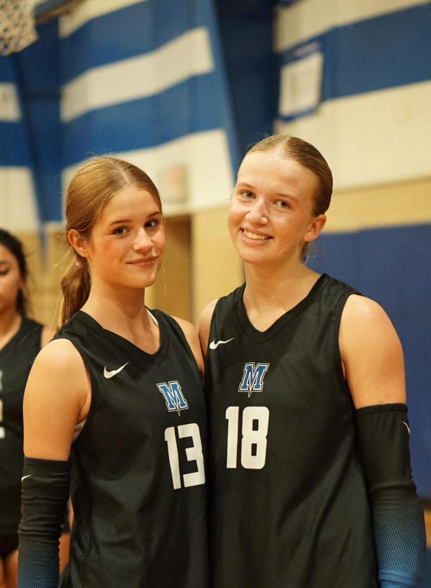 Freshmen Annika Ellwanger (left) and Audrey Moss (right) pose for a picture before the LASA rivalry game.