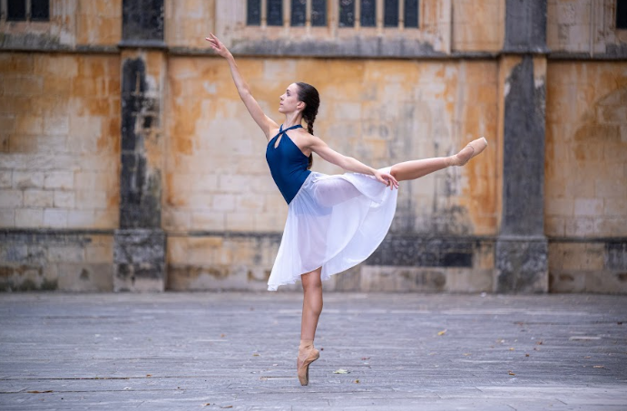 Elizabeth Falkin does an arabesque in Batalha, Portugal during her photo shoot.