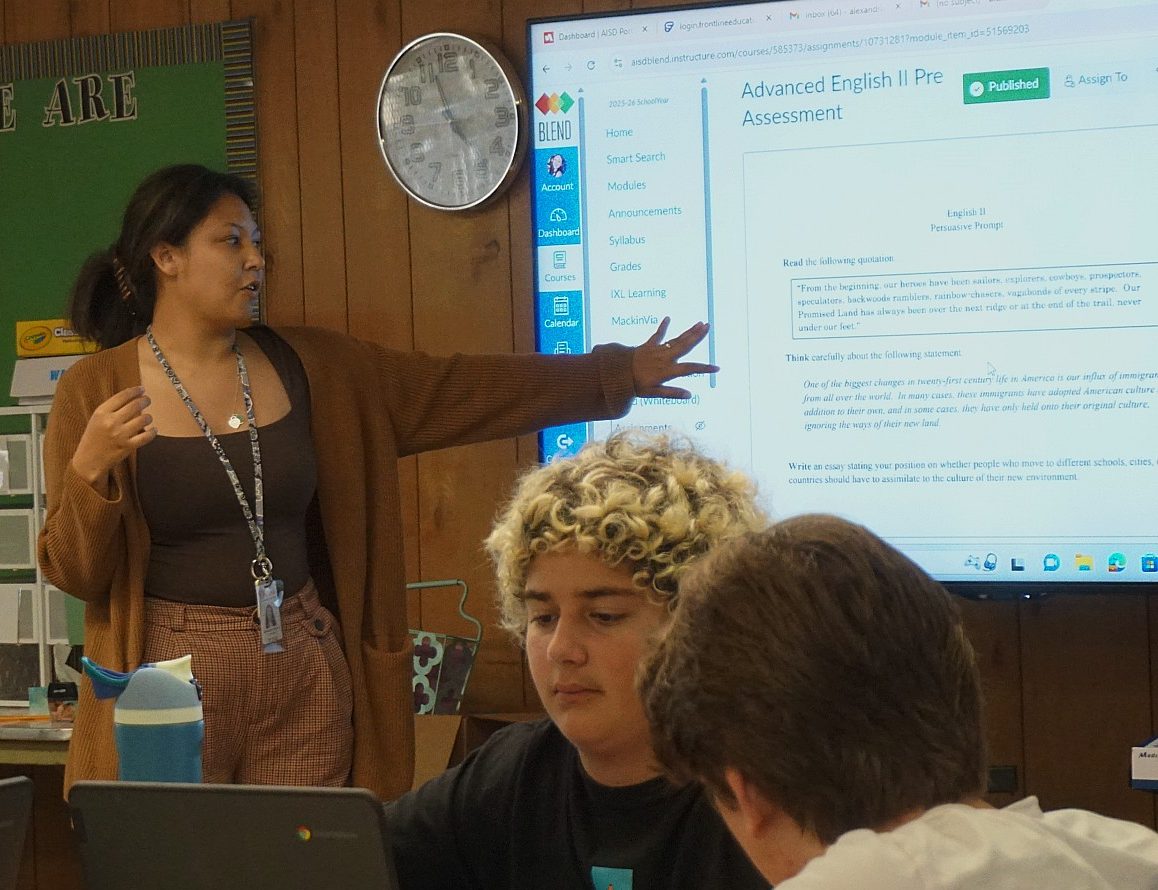 Alexandria Buzzard teaches her second period Advanced English II class. 