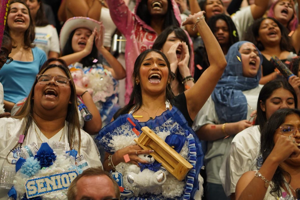 V-I-C-T-O-R-Y: Senior Valeria Villafuerte-Perez celebrates the senior class victory of the homecoming hallway decorating contest at the Homecoming Pep Rally. The seniors also won the victory chant, where classes sing their “battle cry” and the seniors celebrate with confetti poppers and silly string.

“It was really bittersweet because it was the seniors' last Homecoming Pep Rally,” Villafuerte-Perez said, “I was really happy we won both the victory chant and the hallway contest.”

Villafuerte-Perez said she’ll miss the preparation leading up to McCallum’s homecoming week the most. Her mom made her a homecoming mum, and as a senior, she wanted to go all out to celebrate her final homecoming.

“I love homecoming week, especially the game, because I get to wear the mum and show my school spirit,” Villafuerte-Perez said.

Caption by Sienna Martens. 