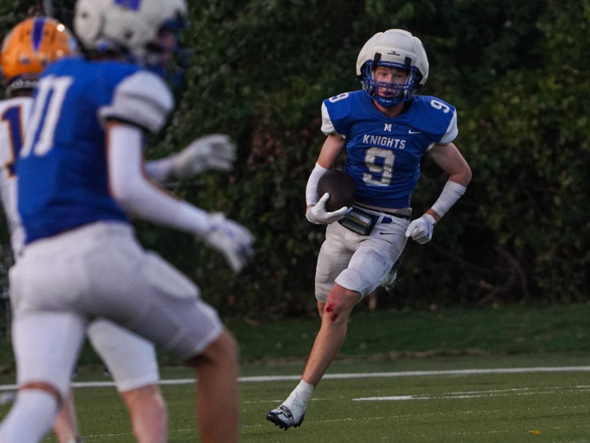 Sophomore Mason White catches a kick return against the Travis Rebels on Sept 4.