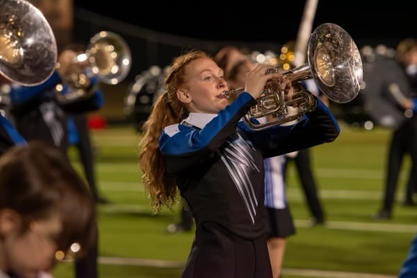 Senior Isadora Lang plays at a football game during last year's band show "Fury Road". Photo courtesy of Lang. 