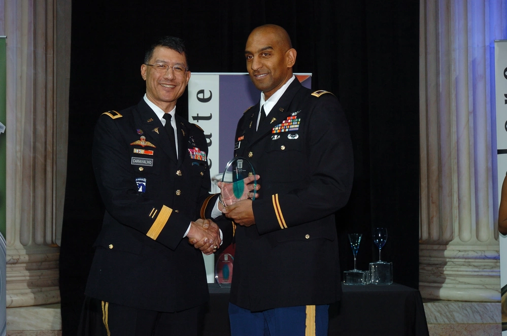 Col. Jeffrey Hutchinson, now pediatrician, non-profit CEO, and part time McCallum substitute, receives the Medical Leadership Award on Feb. 16, 2012. Photo by SFC Scott Turner, part of public domain, released by DVIDS.
