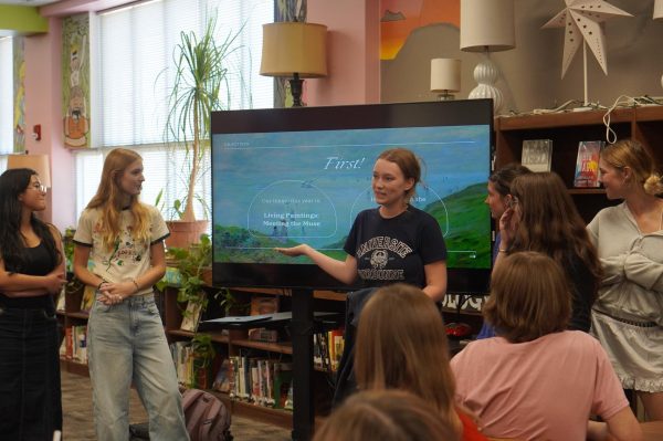 Senior director Lily Walewski leading the fashion shows first meeting for designers on oct. 15.