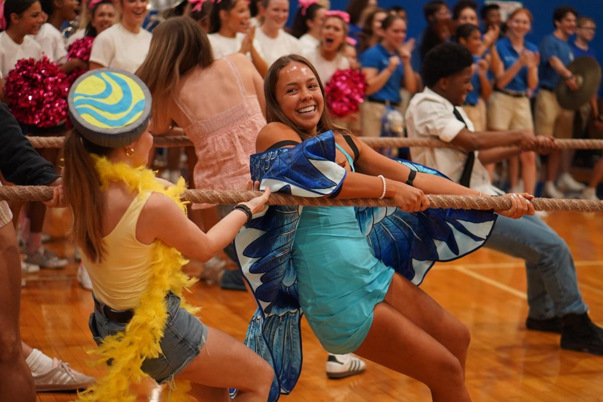 Senior Sienna Gunning plays tug-of-war against the junior team at the Rio day Homecoming pep rally.