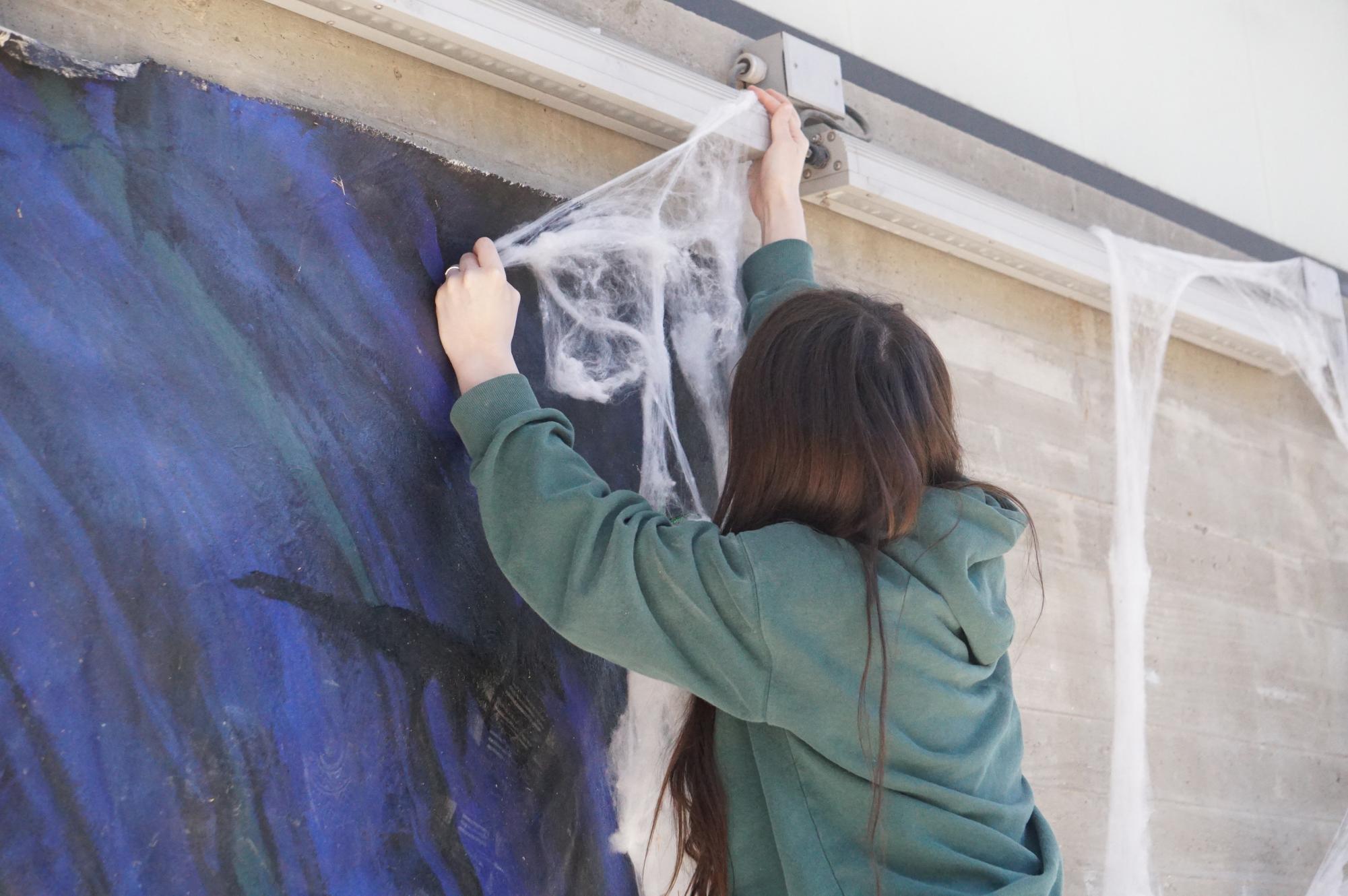A McCallum student sets up for the annual Halloween costume contest held just outside of the Mac.