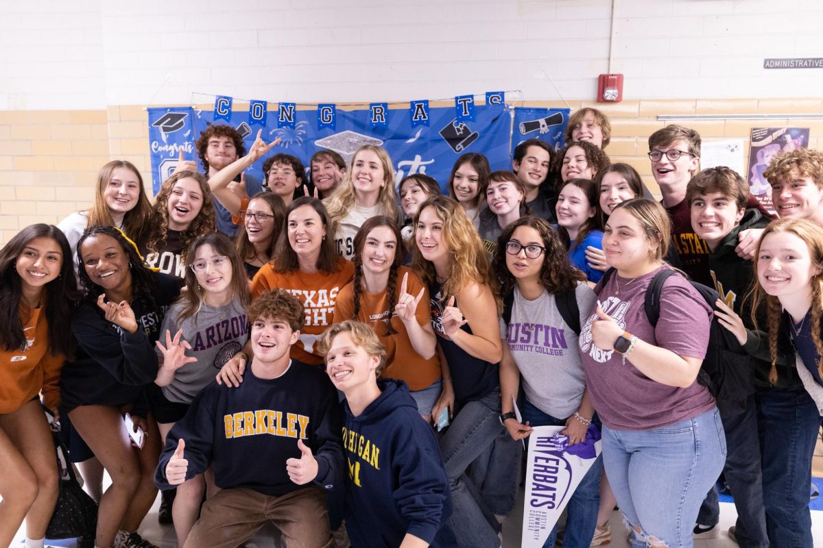Camille Nix poses alongside the McCallum class of 2023 during their Senior Signing Day which took place on May 6, 2023.