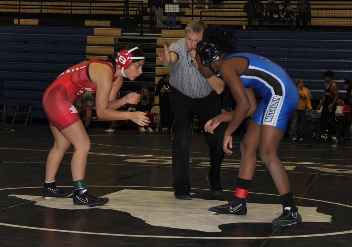 Senior Noble Pierce takes on an opponent in a girls' wrestling match in January.