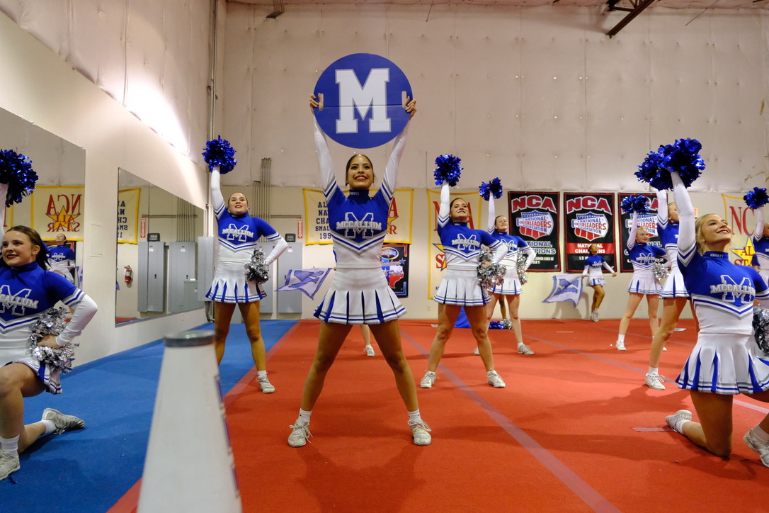 Senior Selene Medina performing with other McCallum cheerleaders for their competition at Cheer Station on Jan.14th. 