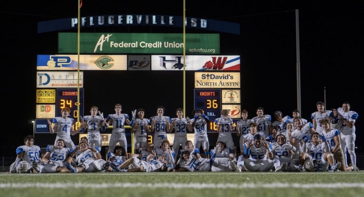 The McCallum varsity football team poses for a picture after taking down Connally and securing a spot in the playoffs. This photo, orchestrated by senior offensive lineman Dylan Fissel, was a highlight in Winters season. 