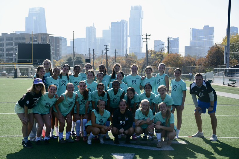 The varsity girls soccer team posing for a team photo at a scrimmage on Dec. 13, 2025.