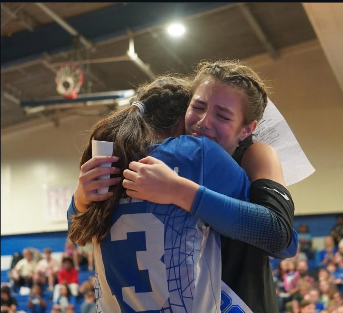 Senior Elliana Rocap hugs her younger sister Aria Rocap on volleyball senior night, on Tuesday Oct. 21st.