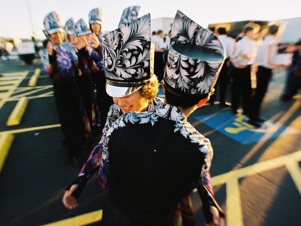 Sophomore Jude DeBerry-DeLeon embraces friends at the UIL Texas state wide marching competition.