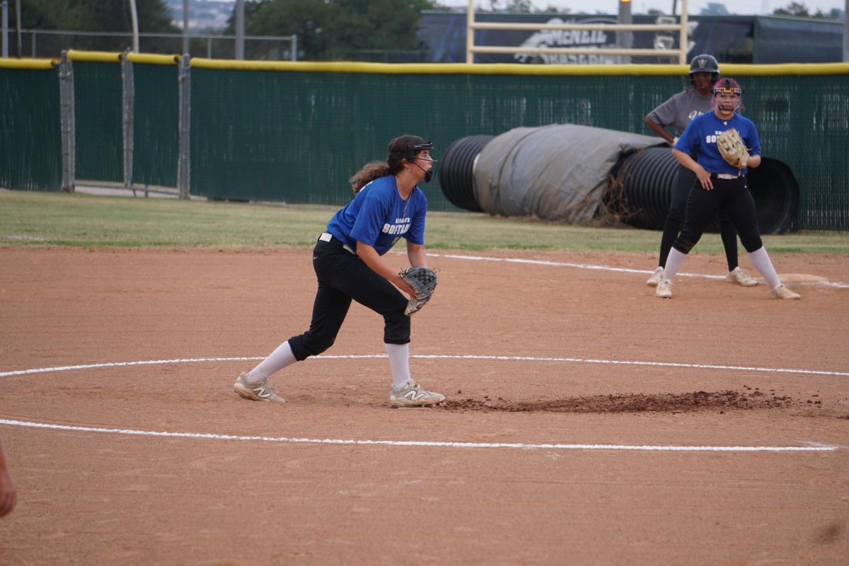Senior Tallulah McColgin pitching at a softball game on Sep. 15.