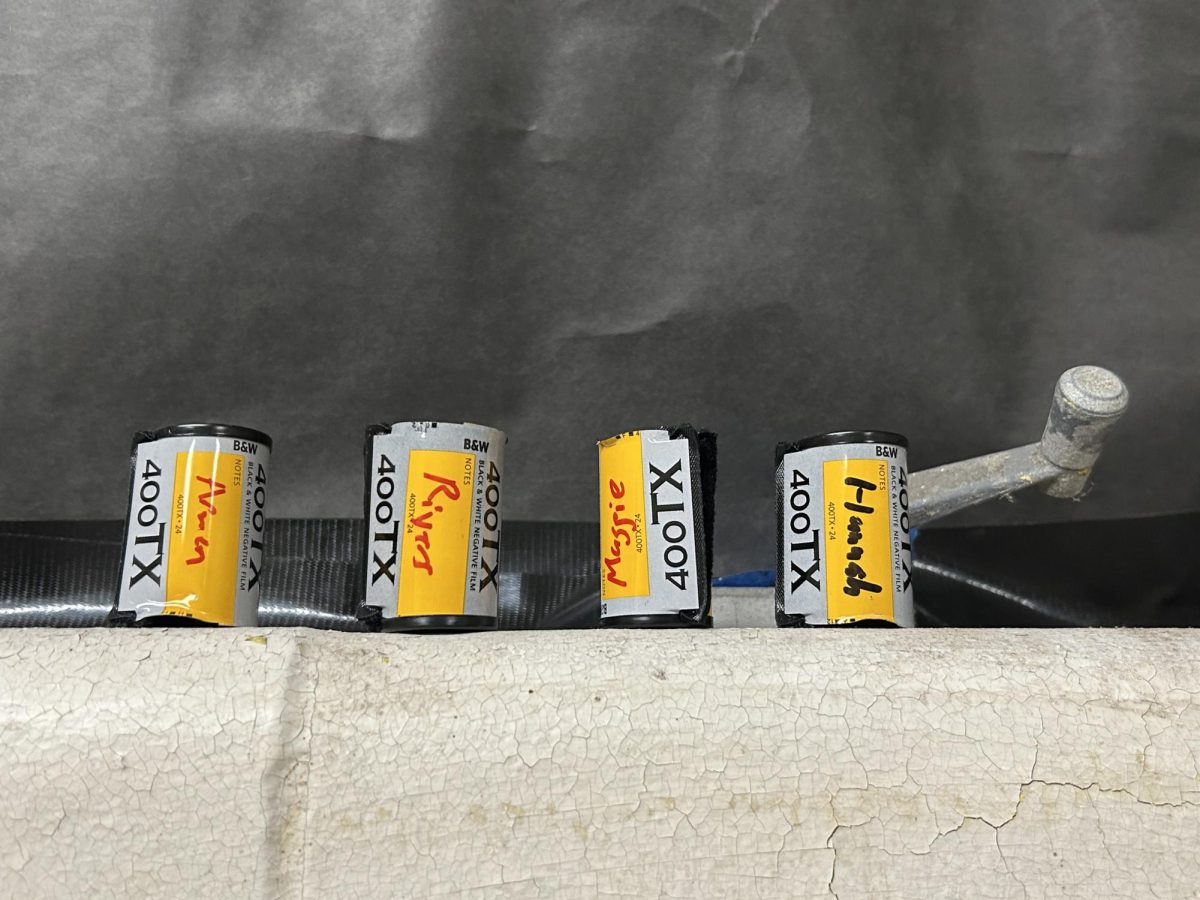 A collection of empty canisters of film in room 134's darkroom 