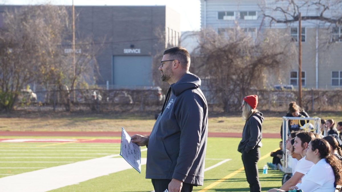 Justin Marlin coaches JV-B girls soccer game at Erhard stadium on Jan. 9.
