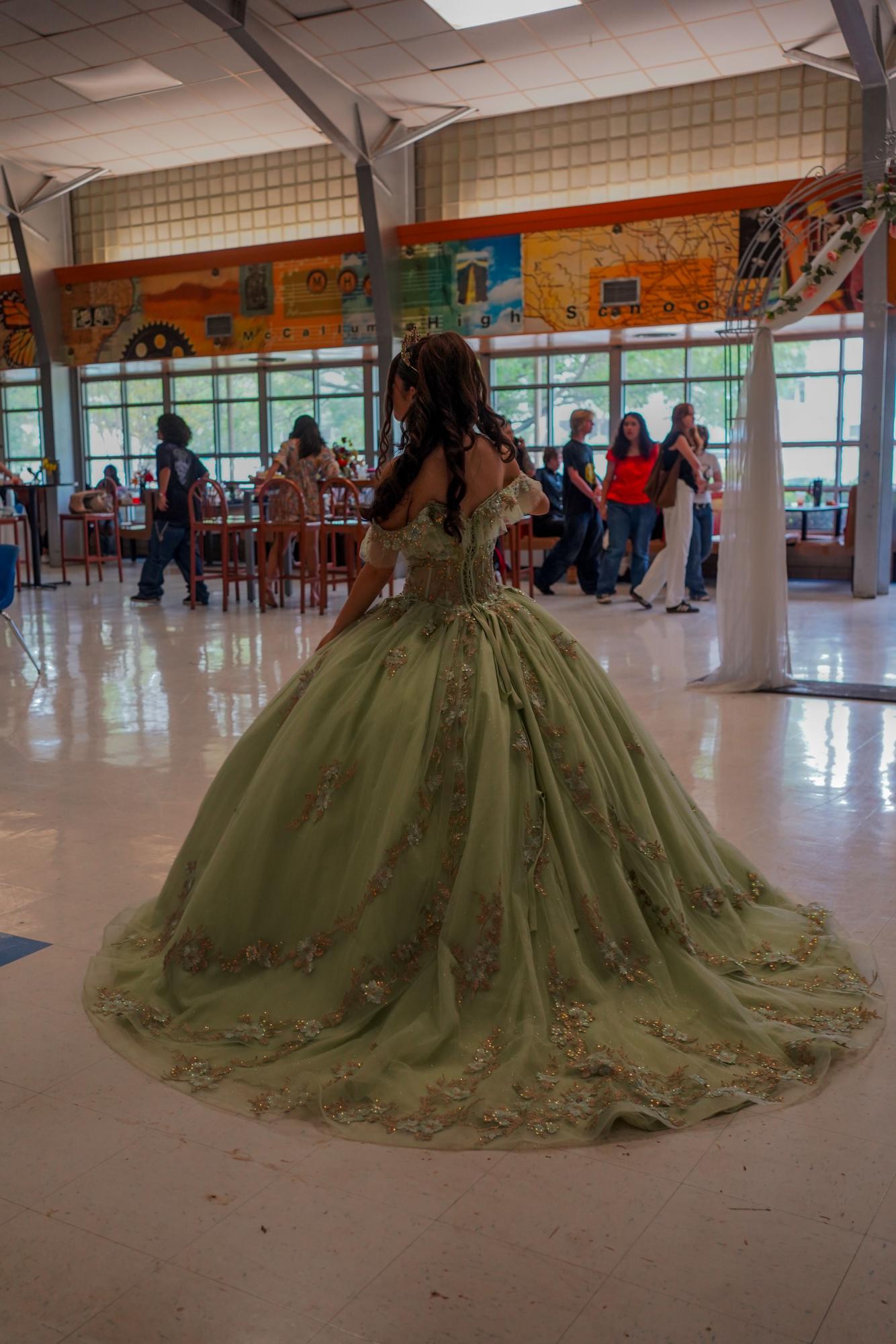 Quinceañera Envy Flores walking to her family during the Quince.
