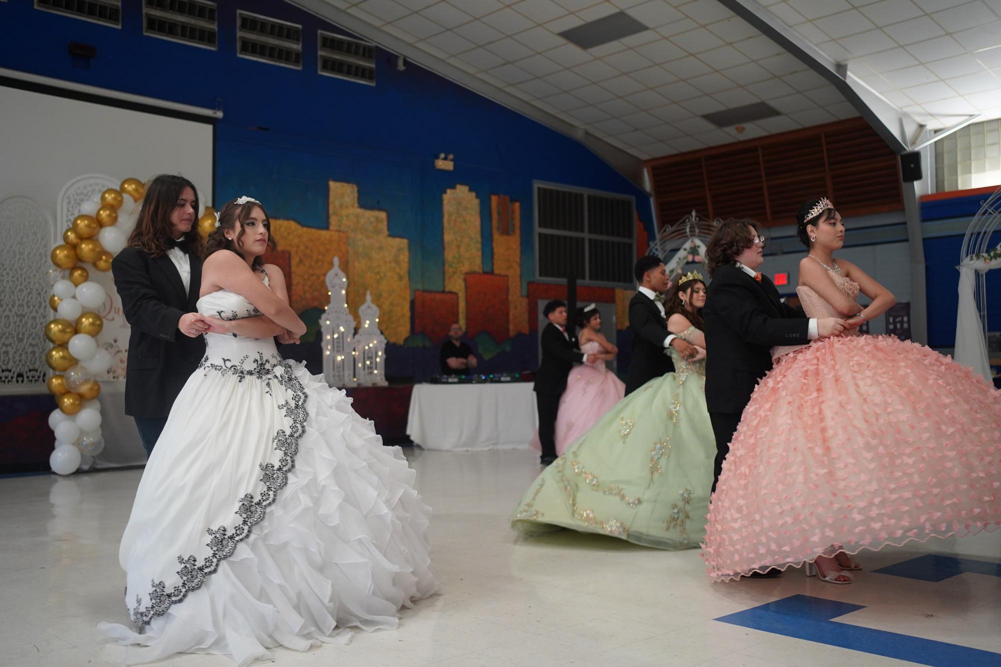 The Quinceañeras and their Chambelanes performing the waltz.