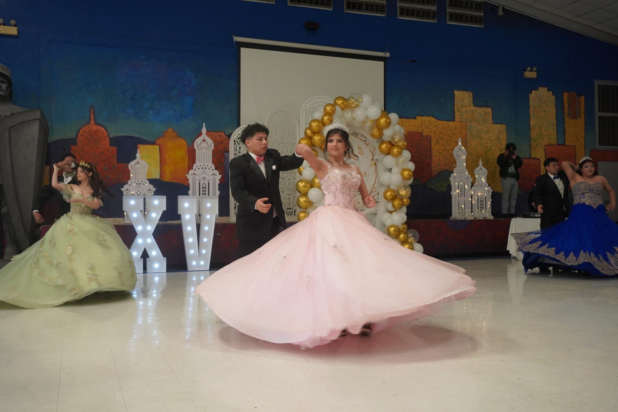 Freshman Quinceañera Maggie Young spinning during the waltz.