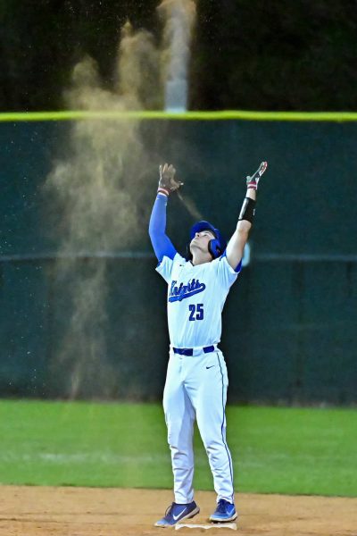 Satterwhite does his Lebron James double celebration after reaching second base during a game.