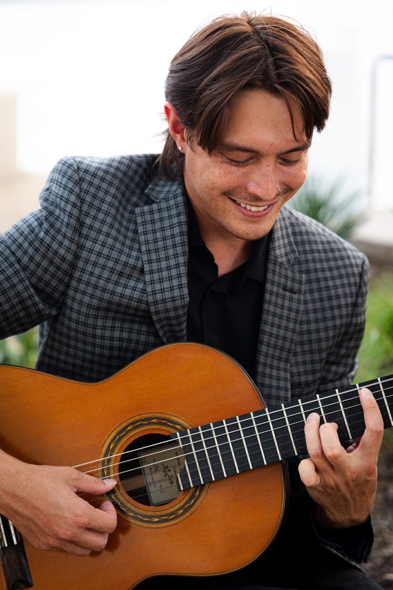 McCallum alumni Alex Lew playing his guitar. Photo courtesy of Lew. 