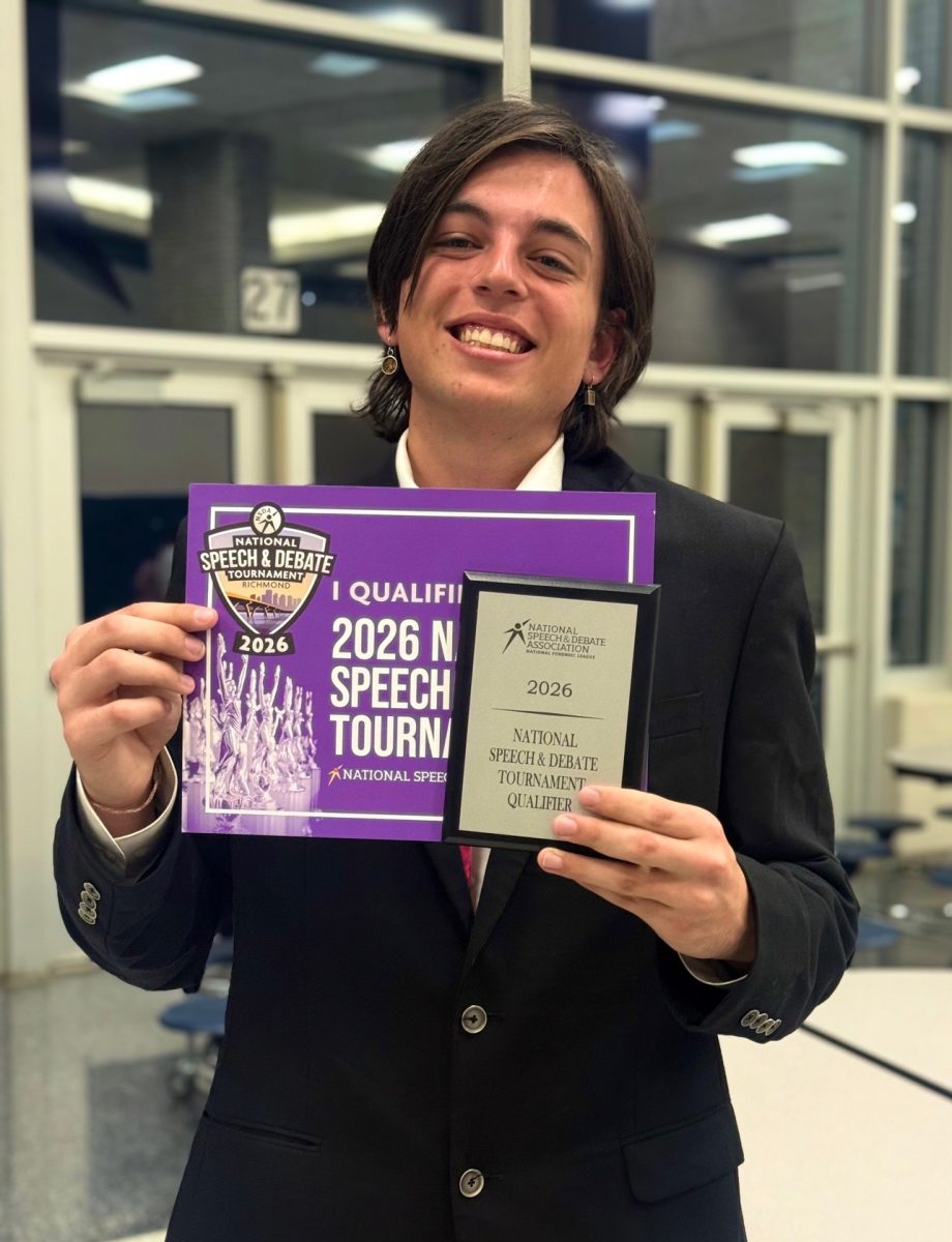Junior Francis Azarian holding up his NDSA national tournamnent qualifying award at the “Heart of Texas” National Qualifying Tournament. Photo courtesy of McCallum speech.