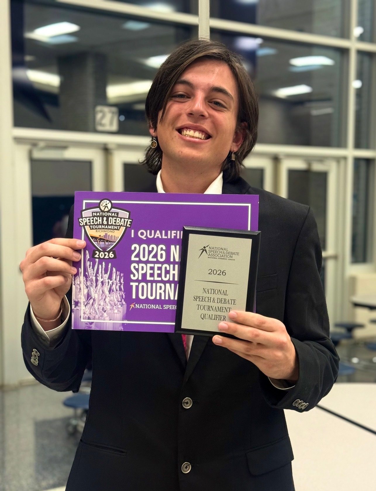Junior Francis Azarian holding up his NDSA national tournamnent qualifying award at the “Heart of Texas” National Qualifying Tournament. Photo courtesy of McCallum speech.