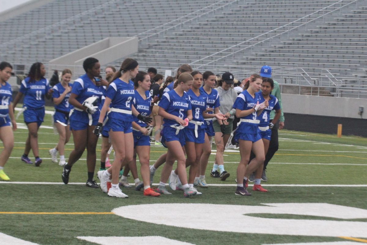 The flag football team walks off the field after playing Crockett on April 18.