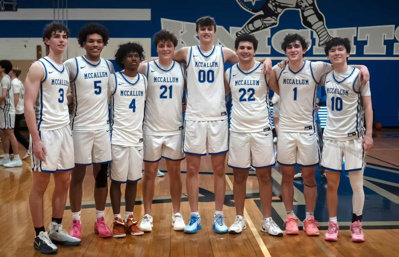 All eight of the senior players pose for a photo after a home game at Don Caldwell Gymnasium.